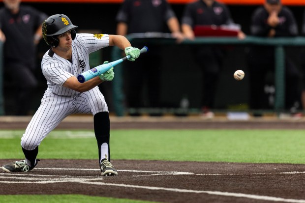 St. Laurence's Connor Marino (23) attempts to bunt against Triad during the Class 3A state semifinal at Duly Health and Care Field in Joliet on Friday, June 13, 2025. (Vincent D. Johnson / for the Daily Southtown)