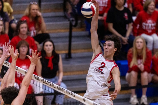 Marist's Christian Teresi (2) spikes the ball against Glenbard West during the state championship game in Hoffman Estates on Saturday, June 7, 2025. (Vincent D. Johnson / for the Daily Southtown)