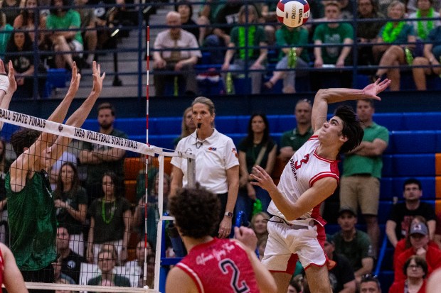 Marist's Nathen Toth (3) spikes the ball against Glenbard West during the state championship game in Hoffman Estates on Saturday, June 7, 2025. (Vincent D. Johnson / for the Daily Southtown)