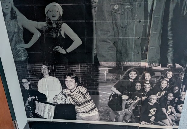 An old photo of Ken Kazin, who just retired as the the band director at Evergreen Park Community High School, is part of a mural on a wall at the school. Kazin just wrapped up nearly 40 years of teaching at the school. (Janice Neumann/Daily Southtown)