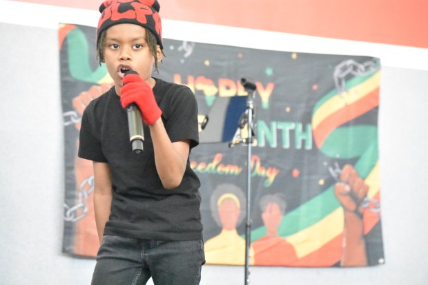 Robert Young Jr., also known as Li'l Rob, raps for the Juneteenth audience June 14, 2025 in Richton Park. (Jesse Wright/for the Daily Southtown)