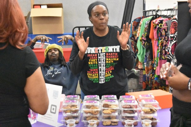 Donnika Burden, of Nika Taste in Park Forest, offers samples of her cookies as one of several area vendors at the Richton Park Juneteenth celebration June 14, 2025. (Jesse Wright/for the Daily Southtown)