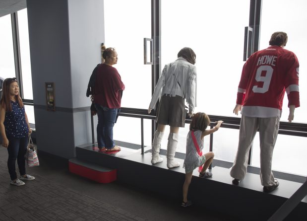 A special exhibit lets visitors stand with the characters from the movie "Ferris Bueller's Day Off" at the Willis Tower Skydeck on June 16, 2016. (Brian Cassella/Chicago Tribune)