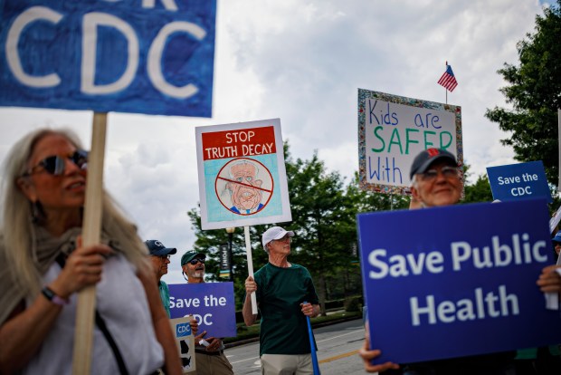 Demonstrators gather across from the Centers for Disease Control and Prevention headquarters during a staff walkout to protest the dismantling of the Advisory Committee on Immunization Practices in Atlanta on June 10, 2025. Robert F. Kennedy Jr., the health secretary, on Monday fired all 17 members of the advisory committee, saying the move would restore the public's trust in vaccines. (Melissa Golden/The New York Times)