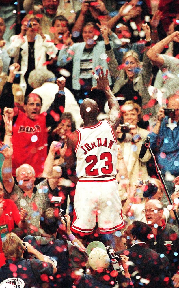 The Bulls Michael Jordan acknowledges the crowd after the team's fifth NBA Championship, June 13, 1997, at the United Center in Chicago. (Nuccio DiNuzzo/Chicago Tribune)