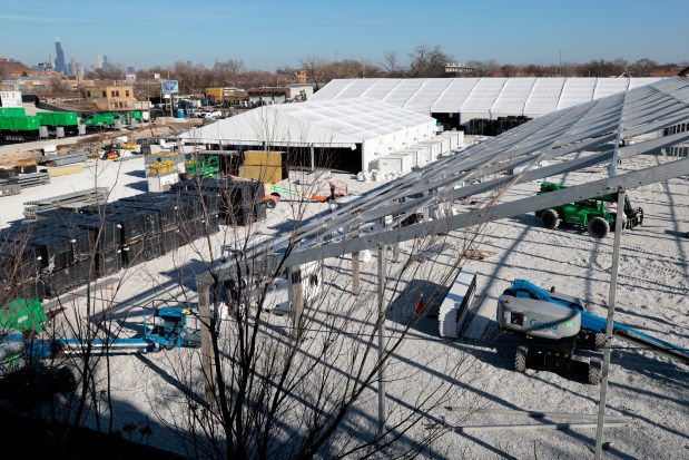 Work begins on the dismantling of the formerly proposed Brighton Park migrant tent site in Chicago, on Dec. 7, 2023. (Antonio Perez/Chicago Tribune)