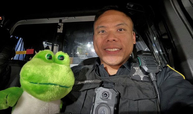 A frog partnered with this police officer. (Courtesy of Waukegan Police Department)