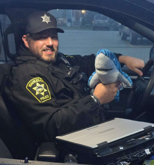 This police officer partners with a shark. (Courtesy of Waukegan Police Department)