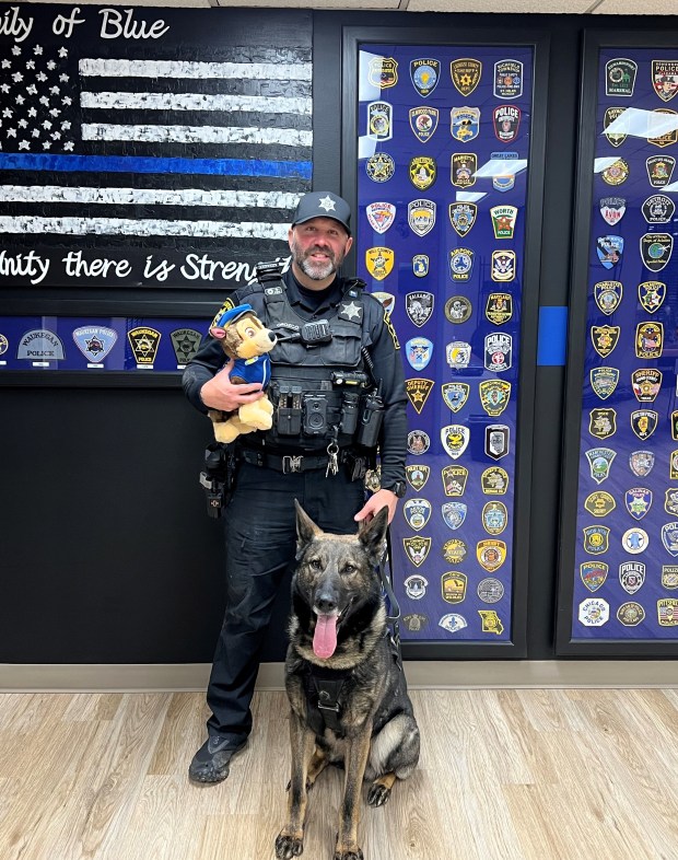 Both a real dog and a toy dog were part of the ride-along program. (Courtesy of Waukegan Police Department)