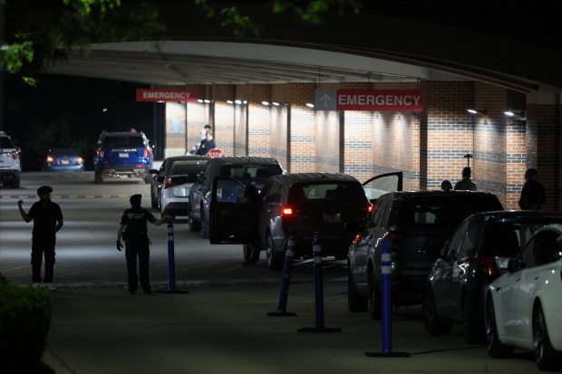 Officers work the scene and guard entrances where one person was shot at Evanston Hospital on Thursday, June 6, 2025. The hospital was placed on lockdown following the shooting. (Audrey Richardson/Chicago Tribune)